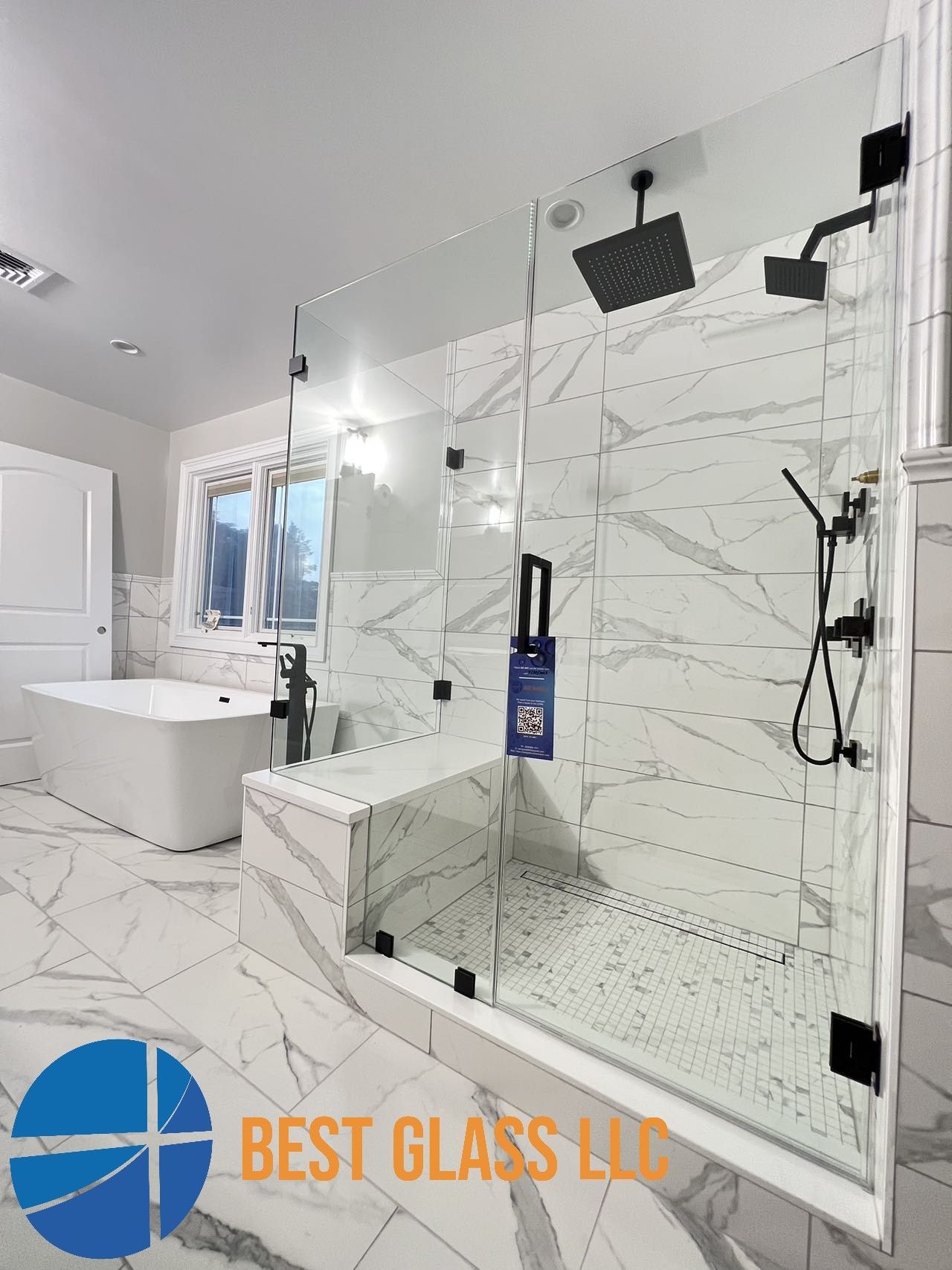 A bathroom with a walk in shower and a bathtub.