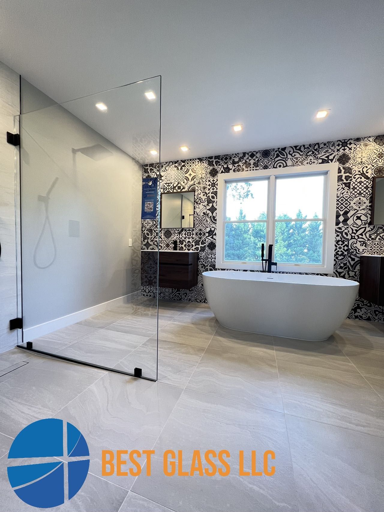 A bathroom with a bathtub and a shower stall.