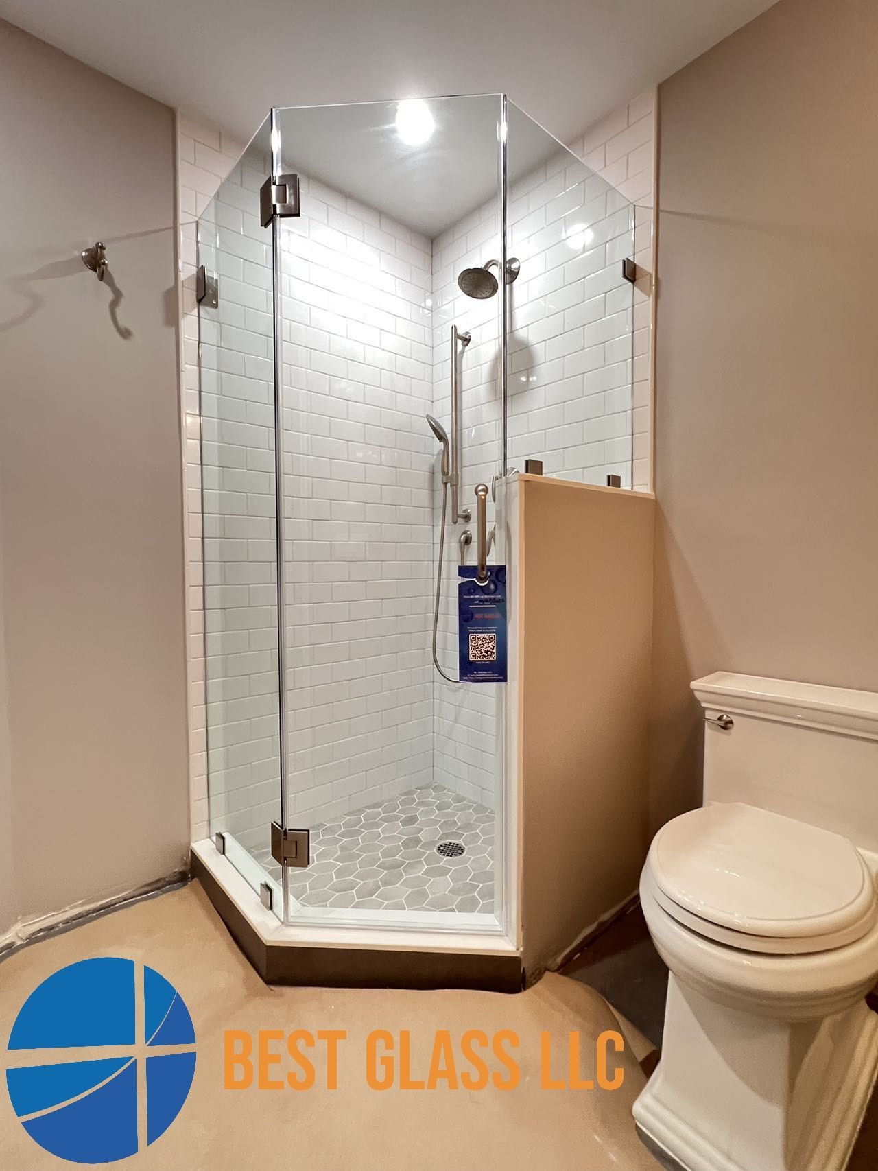 A bathroom with a shower stall and a toilet.