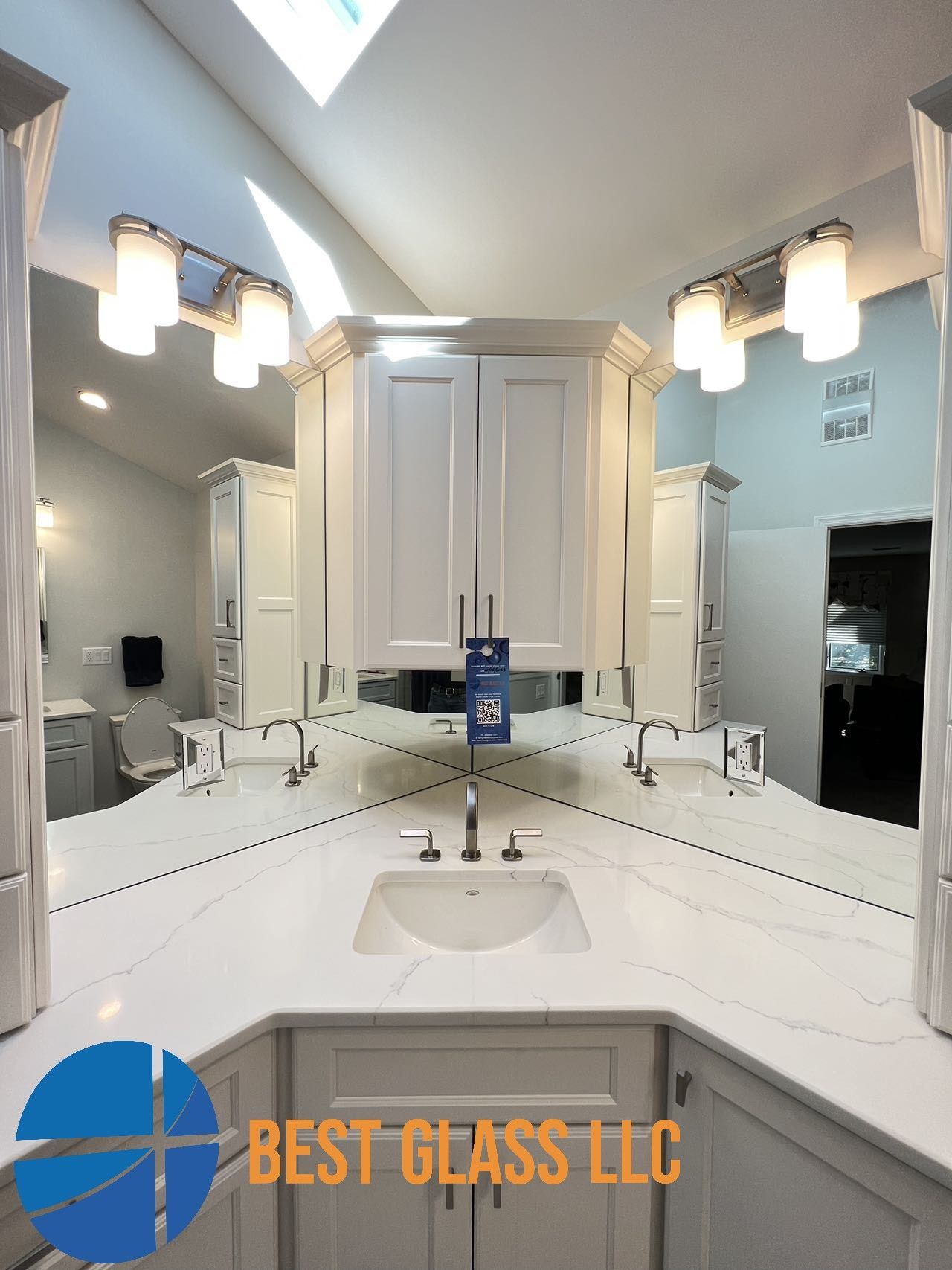 A bathroom with a sink and two mirrors.