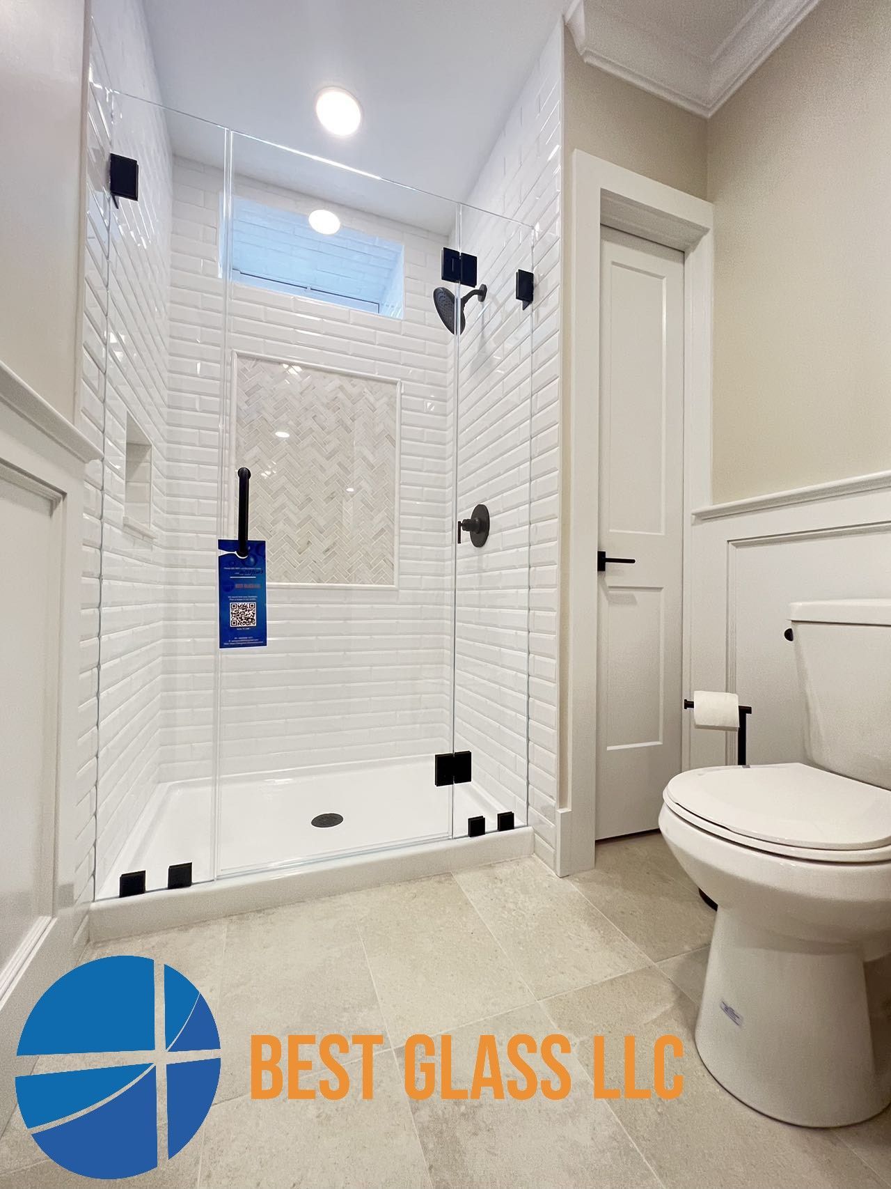 A bathroom with a walk in shower and a toilet.