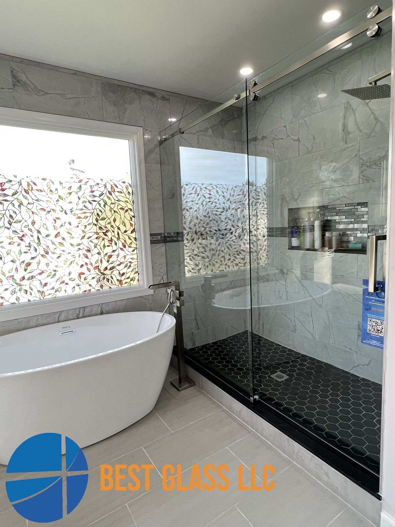 A bathroom with a bathtub and a walk in shower.