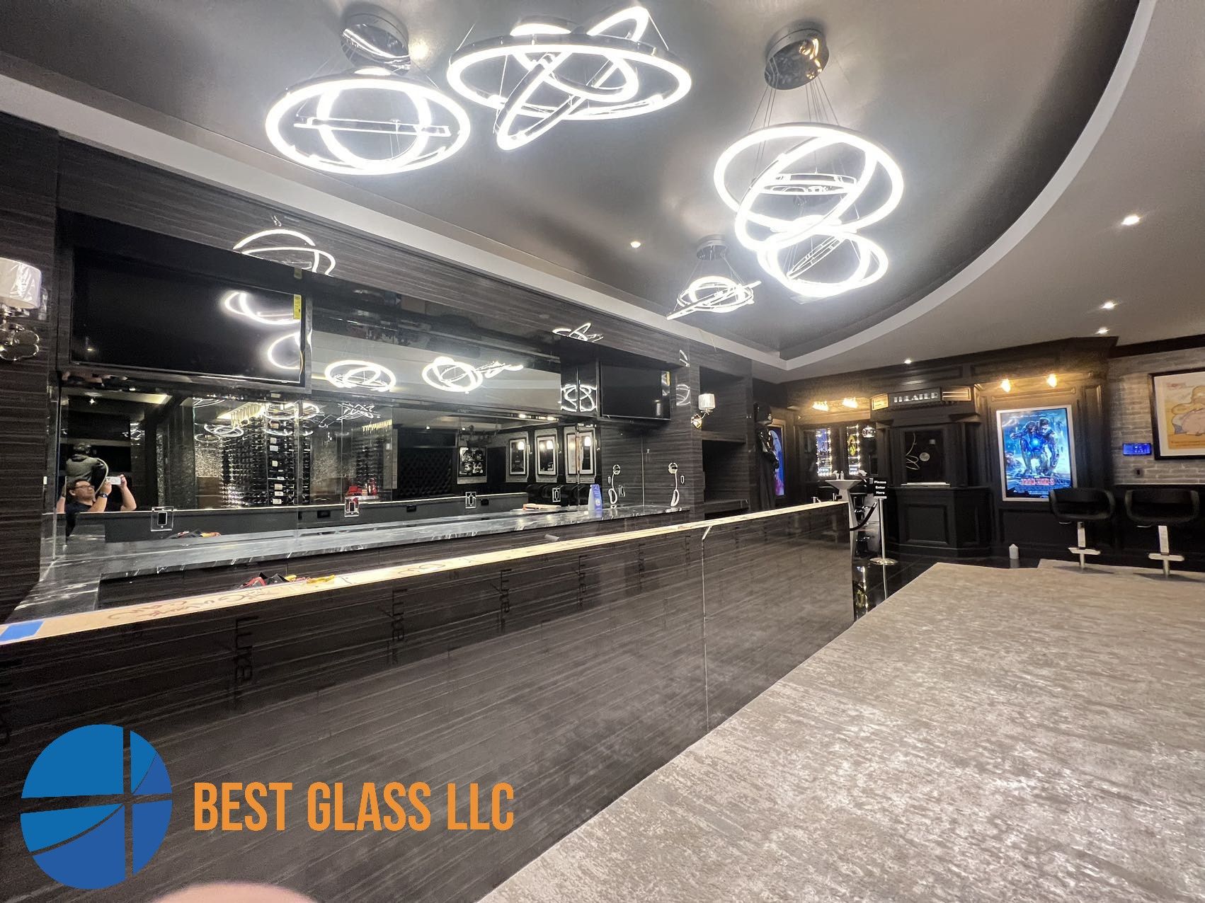 A bar with a lot of lights hanging from the ceiling.