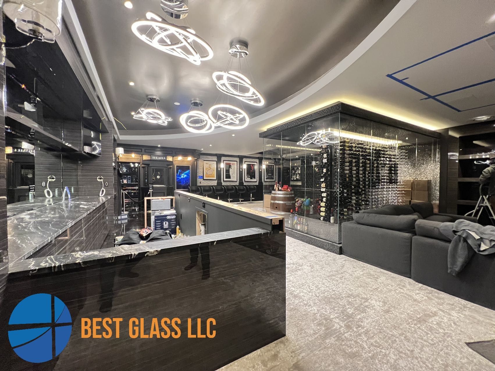 A living room with a bar and a wine cellar.
