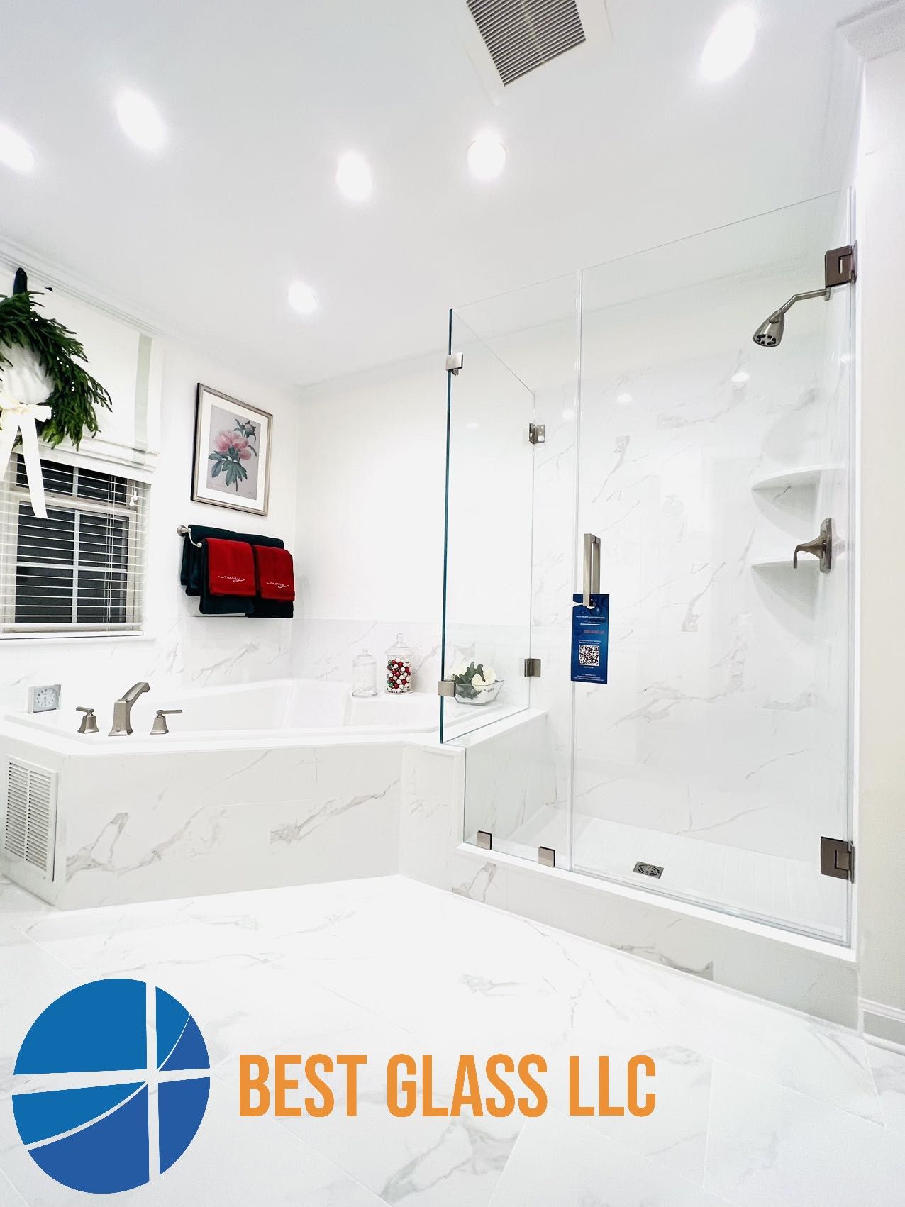 A bathroom with a bathtub , shower , and best glass llc logo
