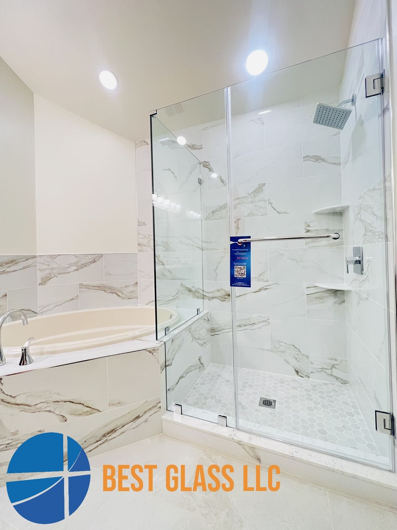 A bathroom with a walk in shower and a bathtub.
