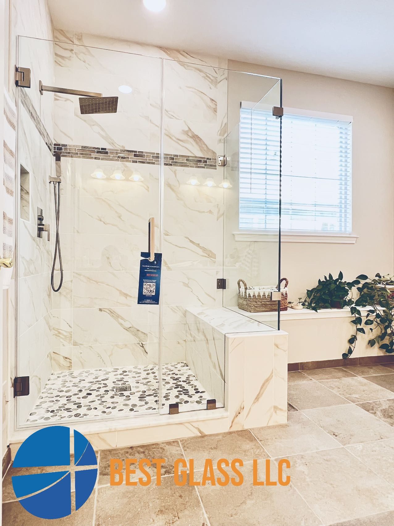 A bathroom with a walk in shower and a window.