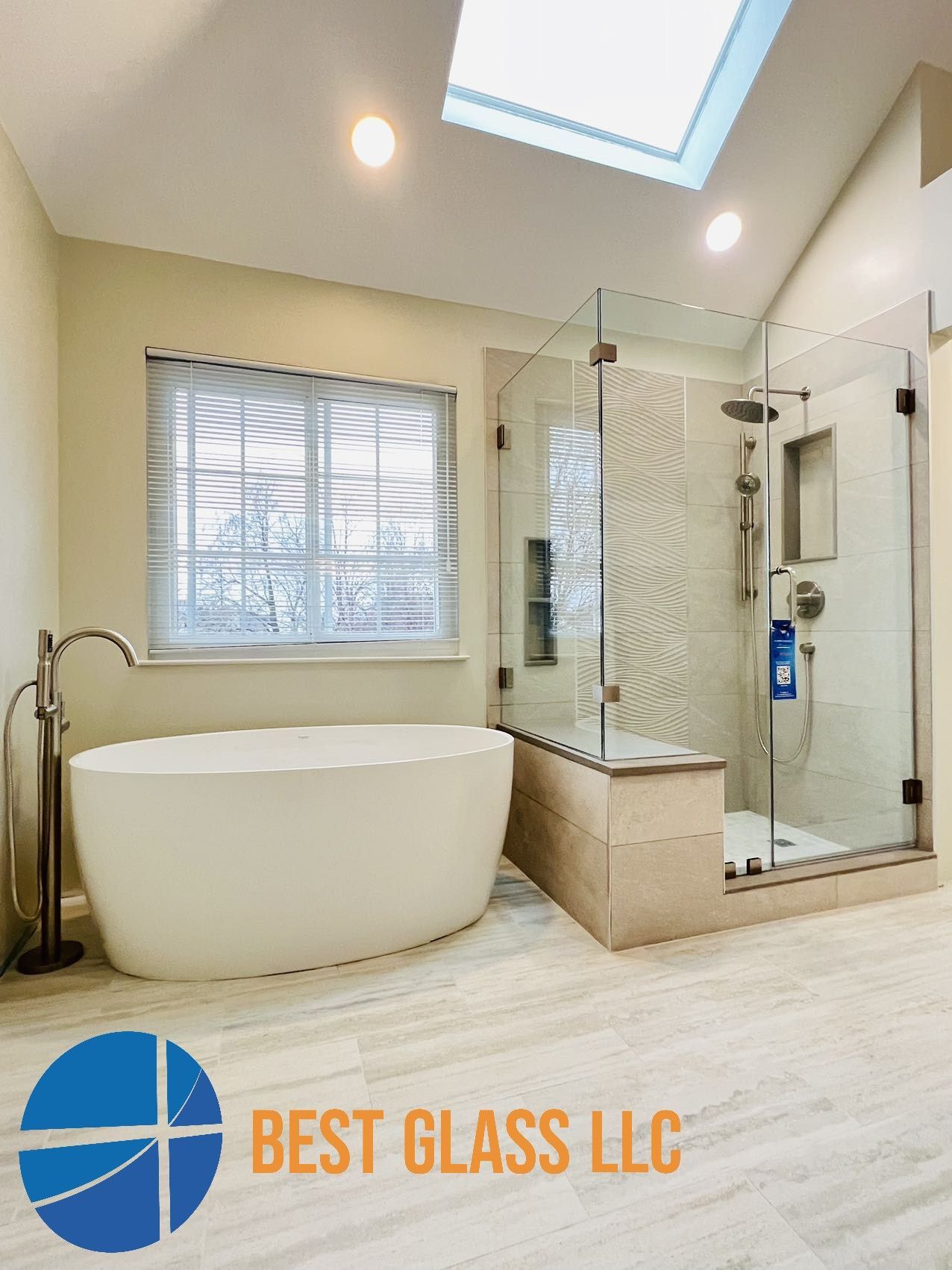 A bathroom with a tub , shower , and skylight.