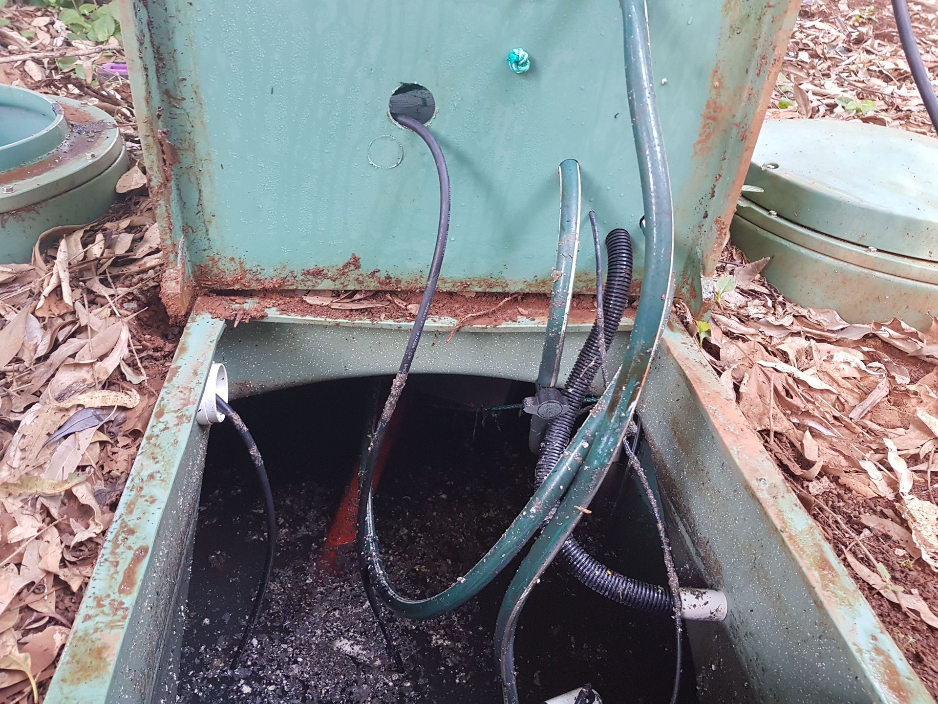 A Green Box With A Hose Coming Out Of It — Northern Rivers and Cape Hawke Septics in Forster, NSW
