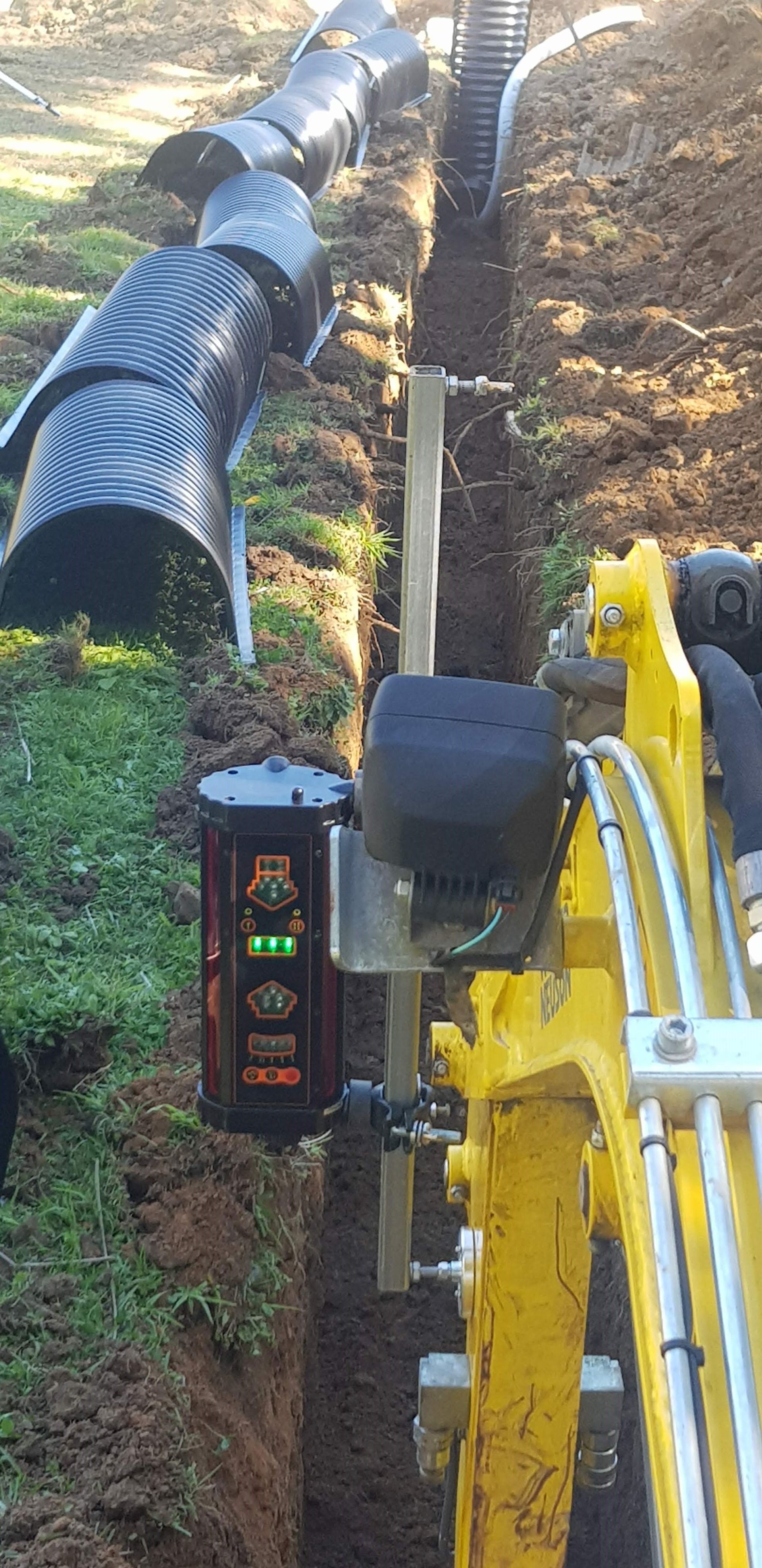 A digger creating a trench — Northern Rivers and Cape Hawke Septics in Forster, NSW