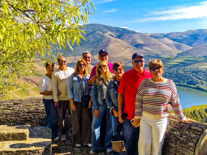 Friends stopping in the Douro Valley for a visit and a wine tasting during a transfer from Lisbon to Porto