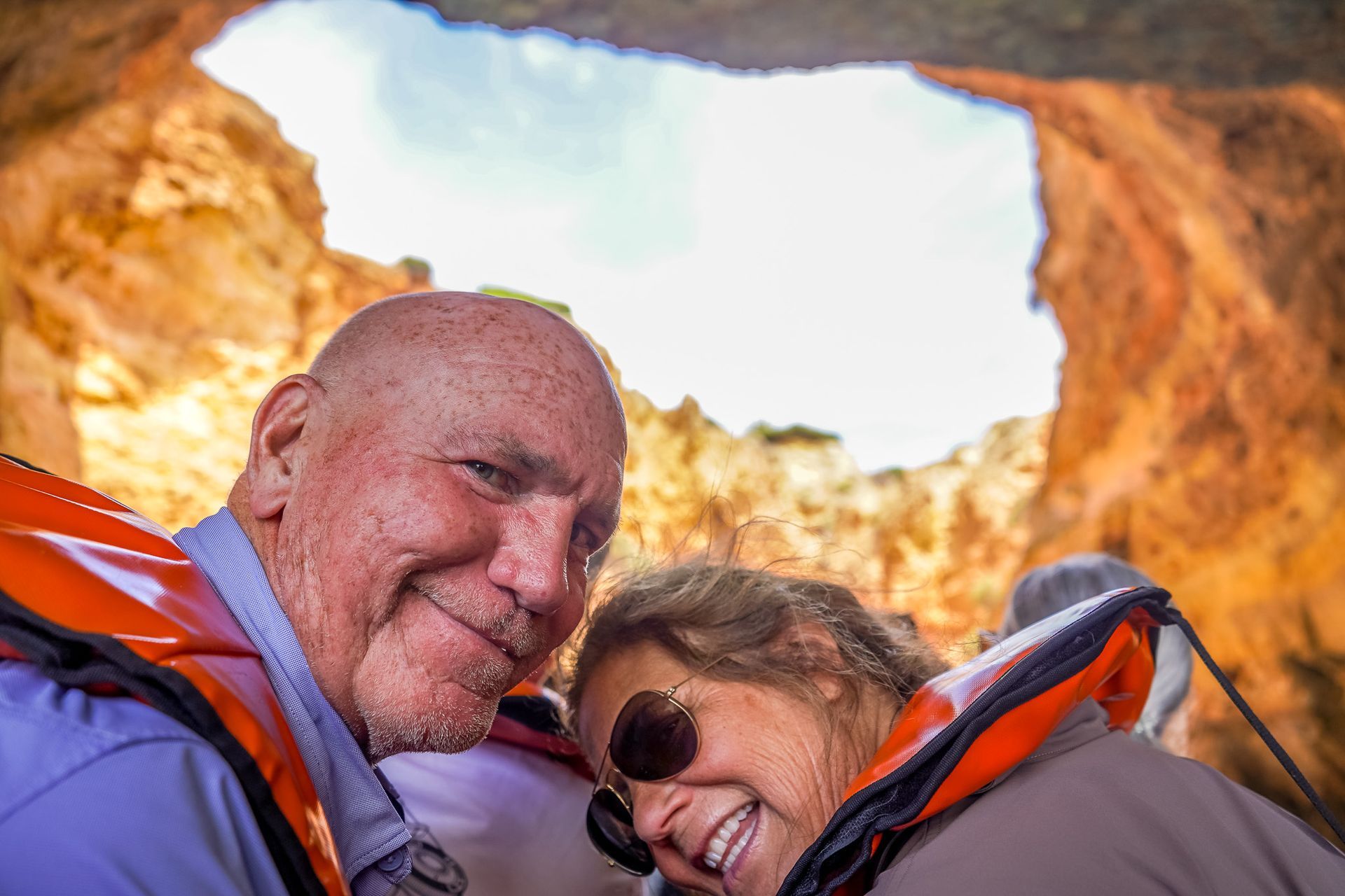 Happy couple on a  boat tour inside Benagil Cave, Algarve