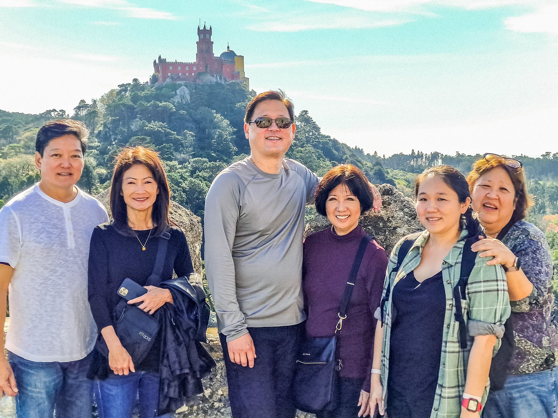 Family in the top of the moorish castle with Pena Palace on their back