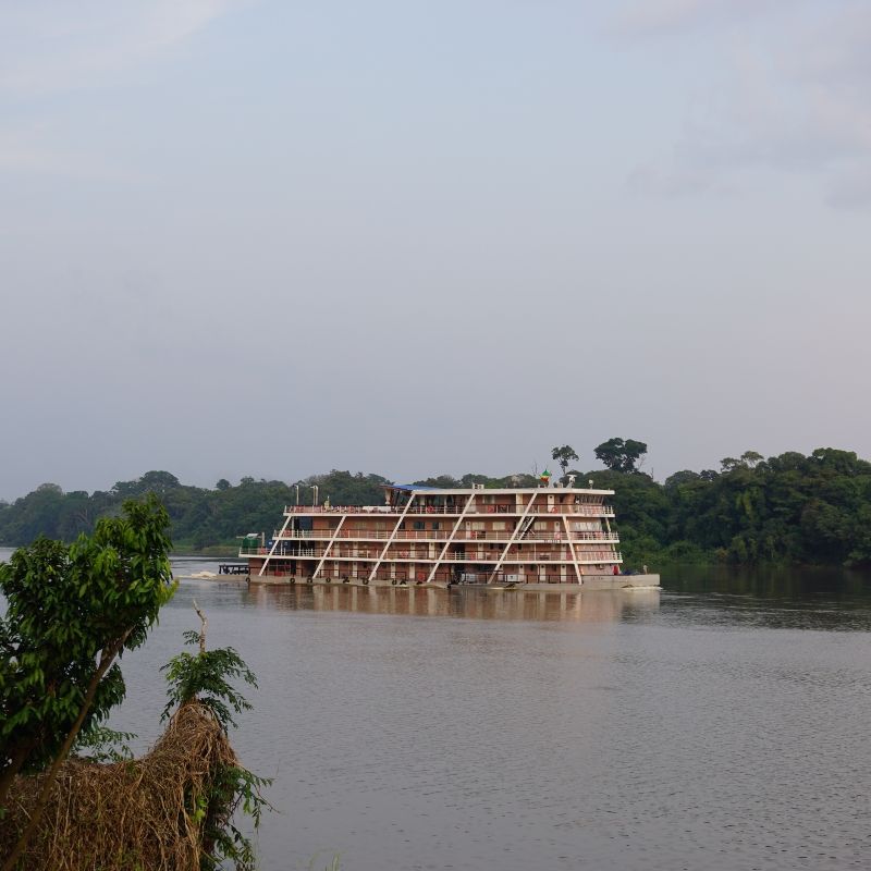 A large boat is floating on a large body of water