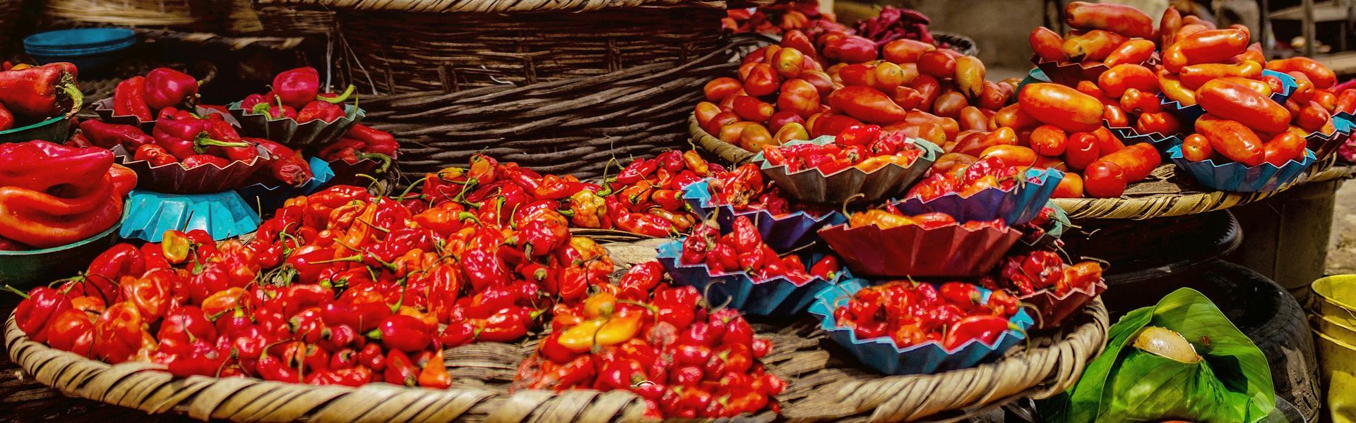 Lagos market stall covered with fiery, red colored chillies