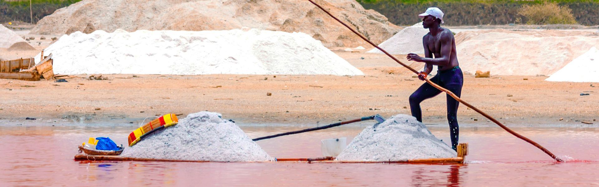 This striking image captures a man pushing his barge loaded with salt across the shimmering surface of Senegal’s iconic Lake Retba, also known as Lac Rose. Famous for its pink hue and high salt content, the lake is both a natural wonder and a center of traditional salt harvesting. Discover the vibrant culture and unique landscapes of Senegal with CicoTours, your trusted local expert for authentic and personalized travel experiences. Africa DMC's, through its network of great locally based tour operators, organizes unforgettable journeys across Senegal—connecting you with the people, traditions, and beauty that define this extraordinary destination.