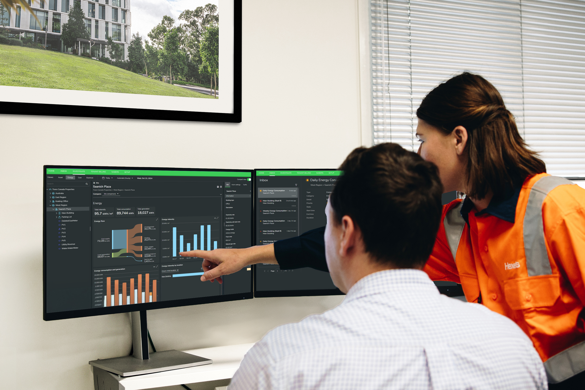 Two Hexeis staff reviewing the real time energy management date available from our Energy Infrastructure Management System
