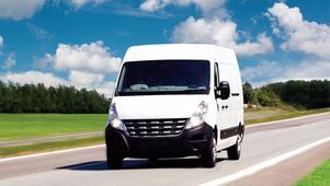 A courier van delivering a same day middle mile shipment between warehouses.