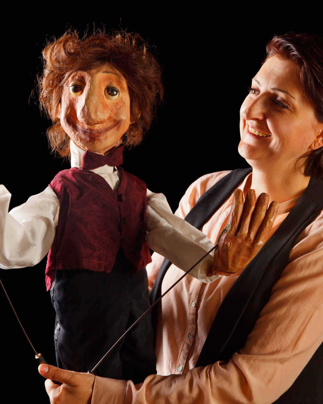 ventriloquist performer poses with puppet