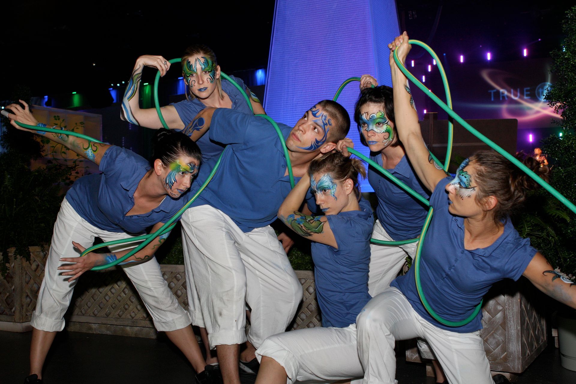 A group of people posing at a live event