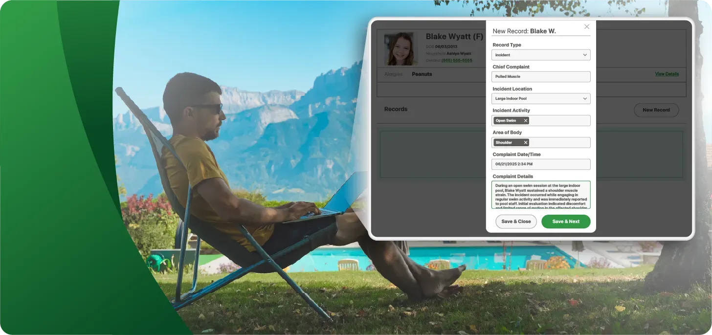 Image of a camp leader inputting a health visit record with an outdoor pool and mountains in the background.