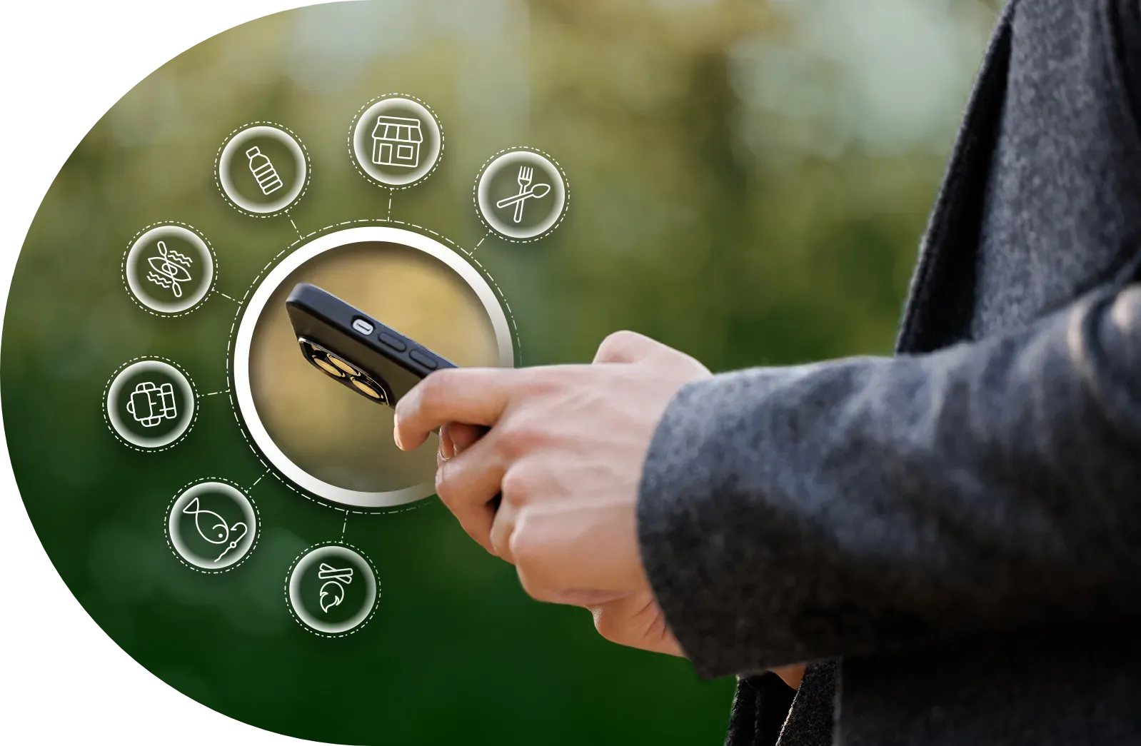 Person holding a phone, with an interactive interface of icons around the screen, against a blurred green background.