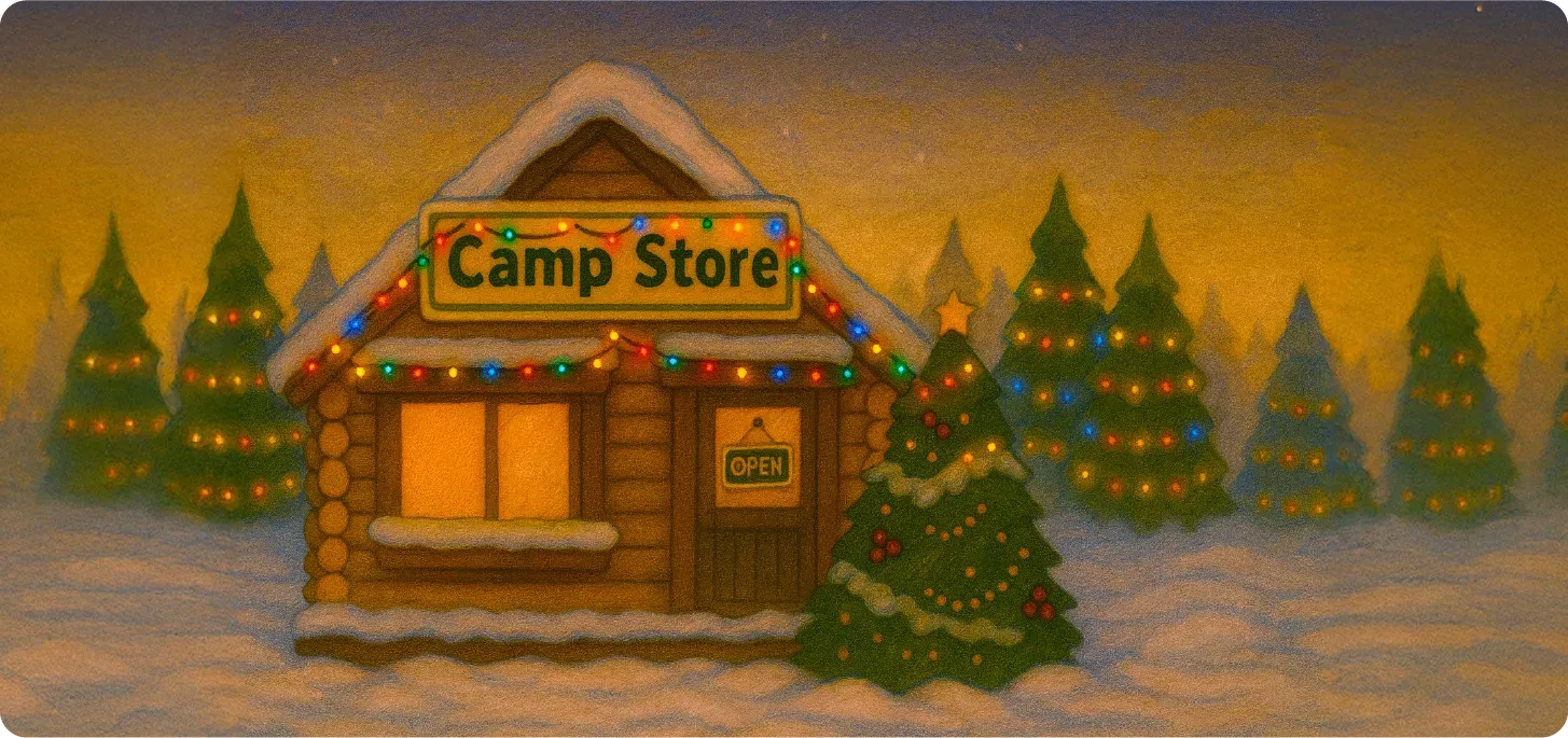 Image of a Camp Store cabin covered in snow, Christmas lights everywhere.