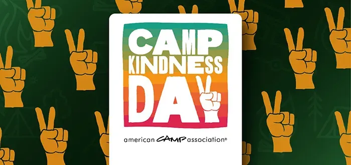 A poster for camp kindness day with peace signs on a green background.