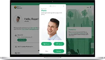 A man's photo is being updated on a computer screen, with green color scheme.