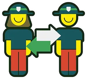 A man and a woman are standing next to each other holding an arrow.