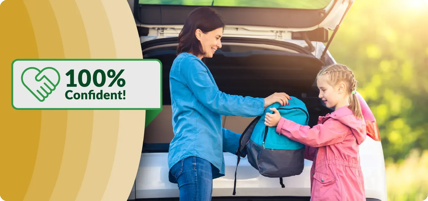 Image of child and mom getting a backpack out of a trunk with smiles. Text:
