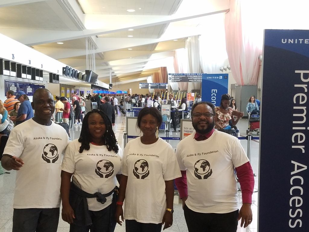 A group of people standing in front of a sign that says premier access