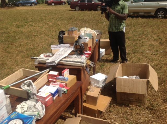 A man standing next to a table full of boxes