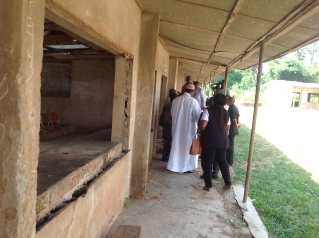 A group of people standing under a covered walkway