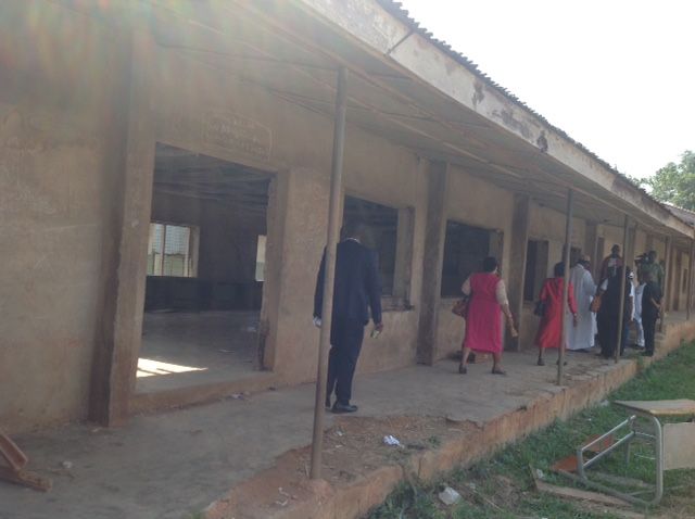 A group of people standing outside of a building