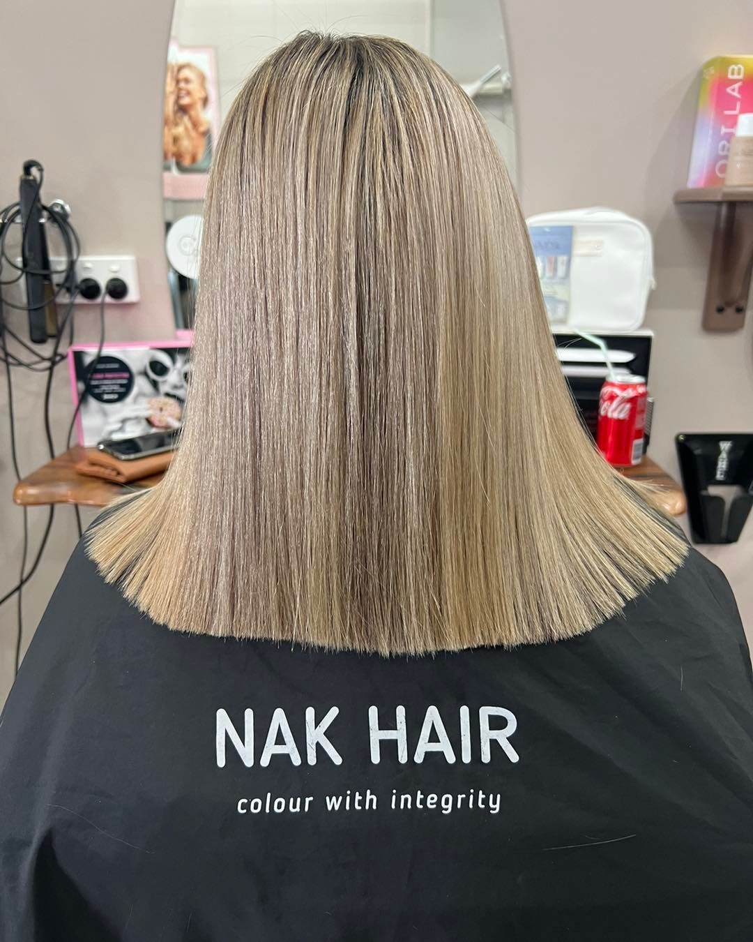 A Woman Is Getting Her Hair Cut — Ammo Hair and Beauty In Maclean, NSW