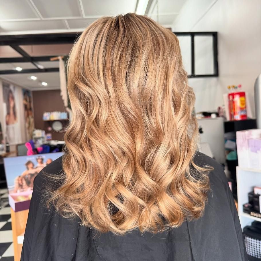 The Back of a Woman 's Hair is Shown in a Salon — Ammo Hair and Beauty In Maclean, NSW