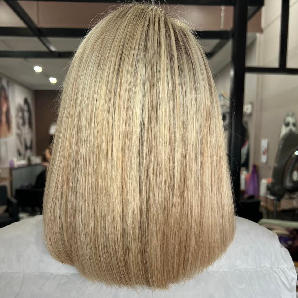 The Back of A Woman 's Blonde Hair Is Shown — Ammo Hair and Beauty In Maclean, NSW