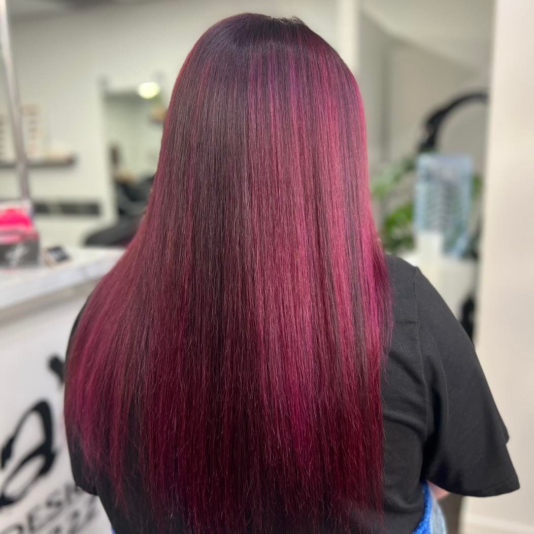 A Woman with Long Red Hair Is Standing in A Salon — Ammo Hair and Beauty In Maclean, NSW