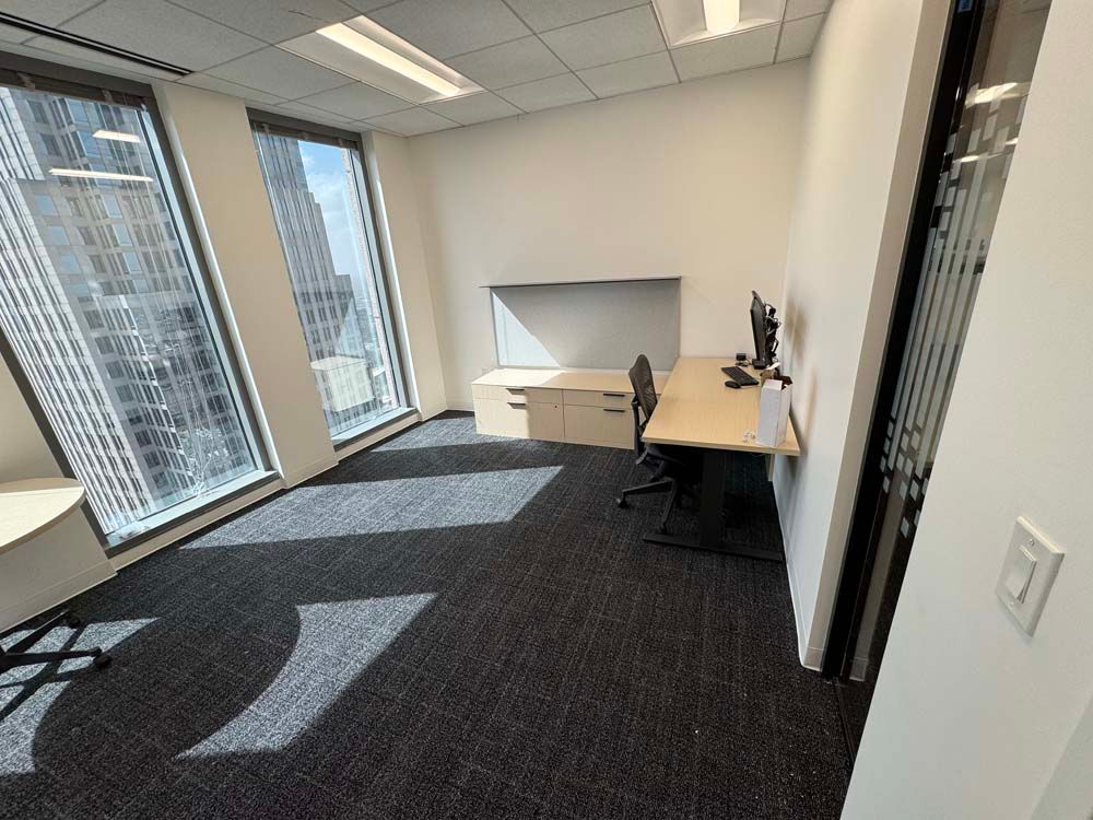 A room with a desk and a computer in it