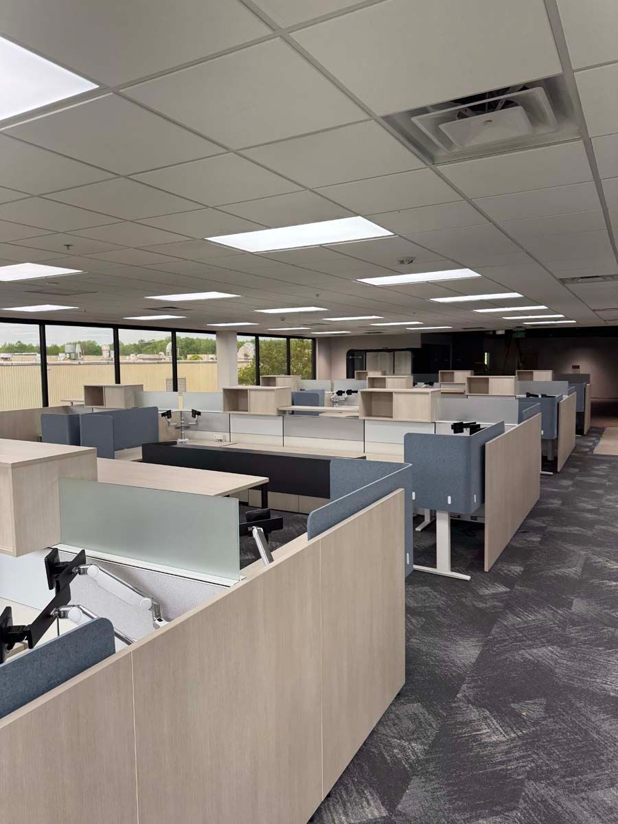A large office with a lot of cubicles and desks