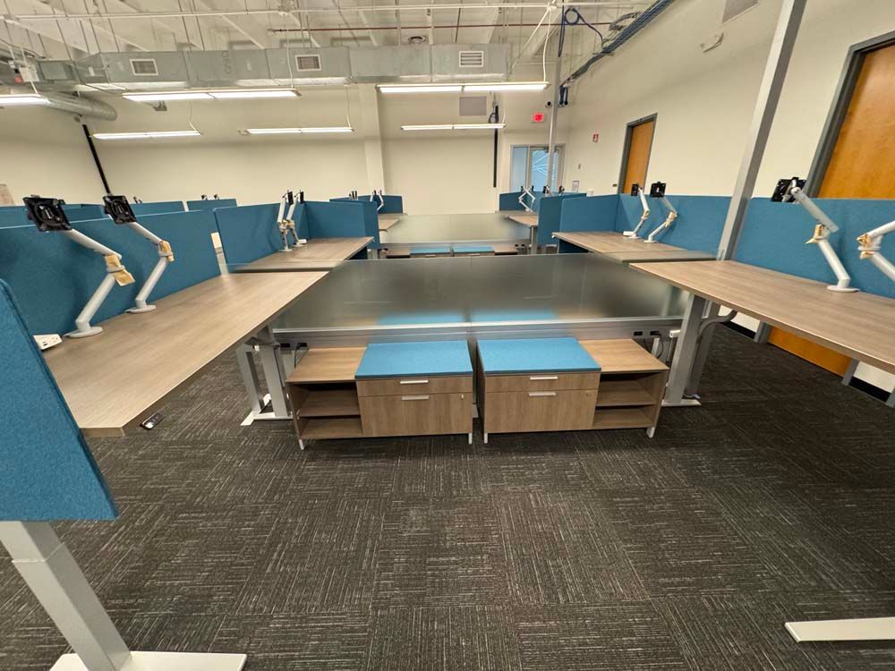 A large room with a lot of desks and cubicles