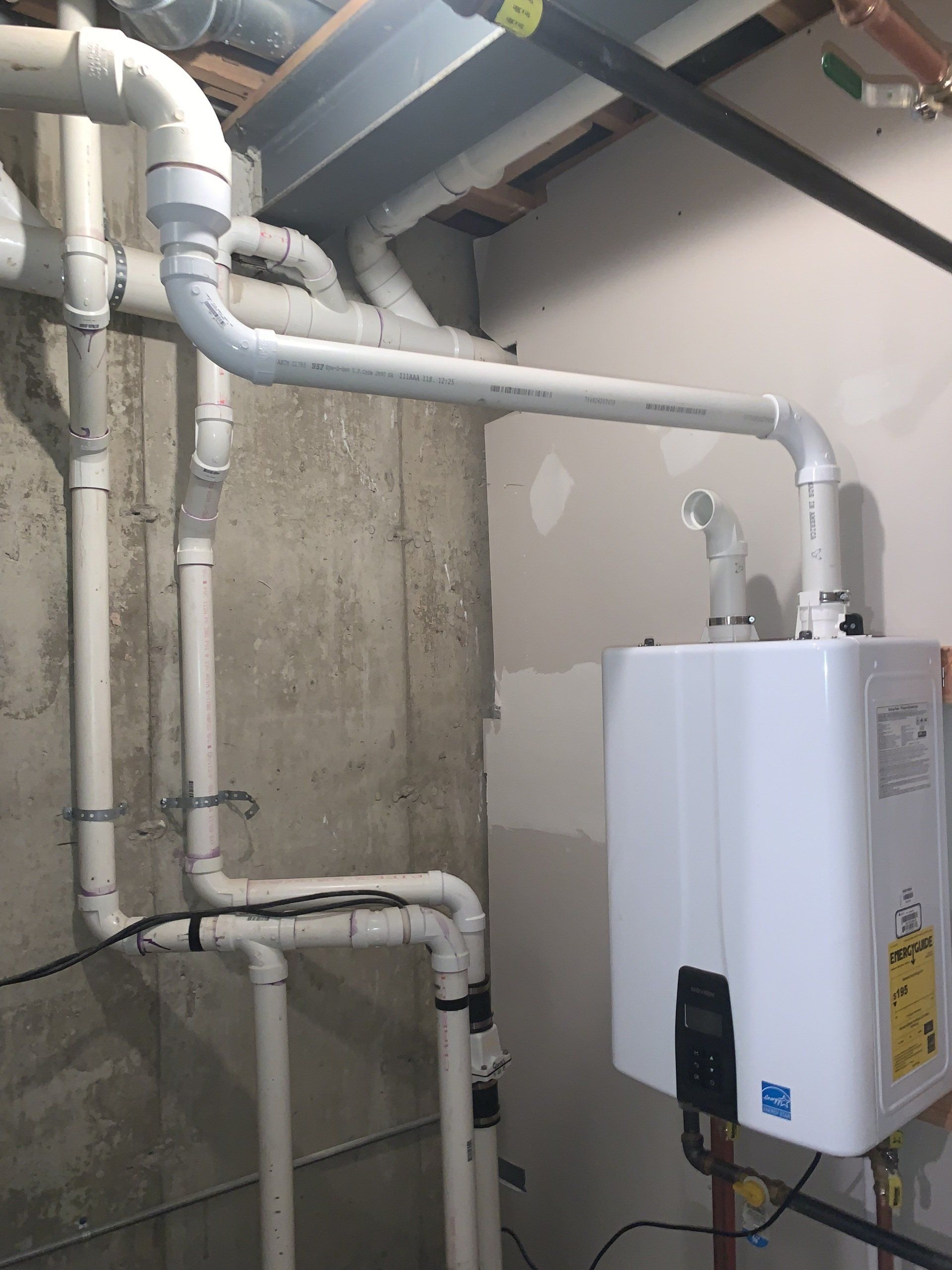 Elmhurst Tankless water heater installed in basement.
