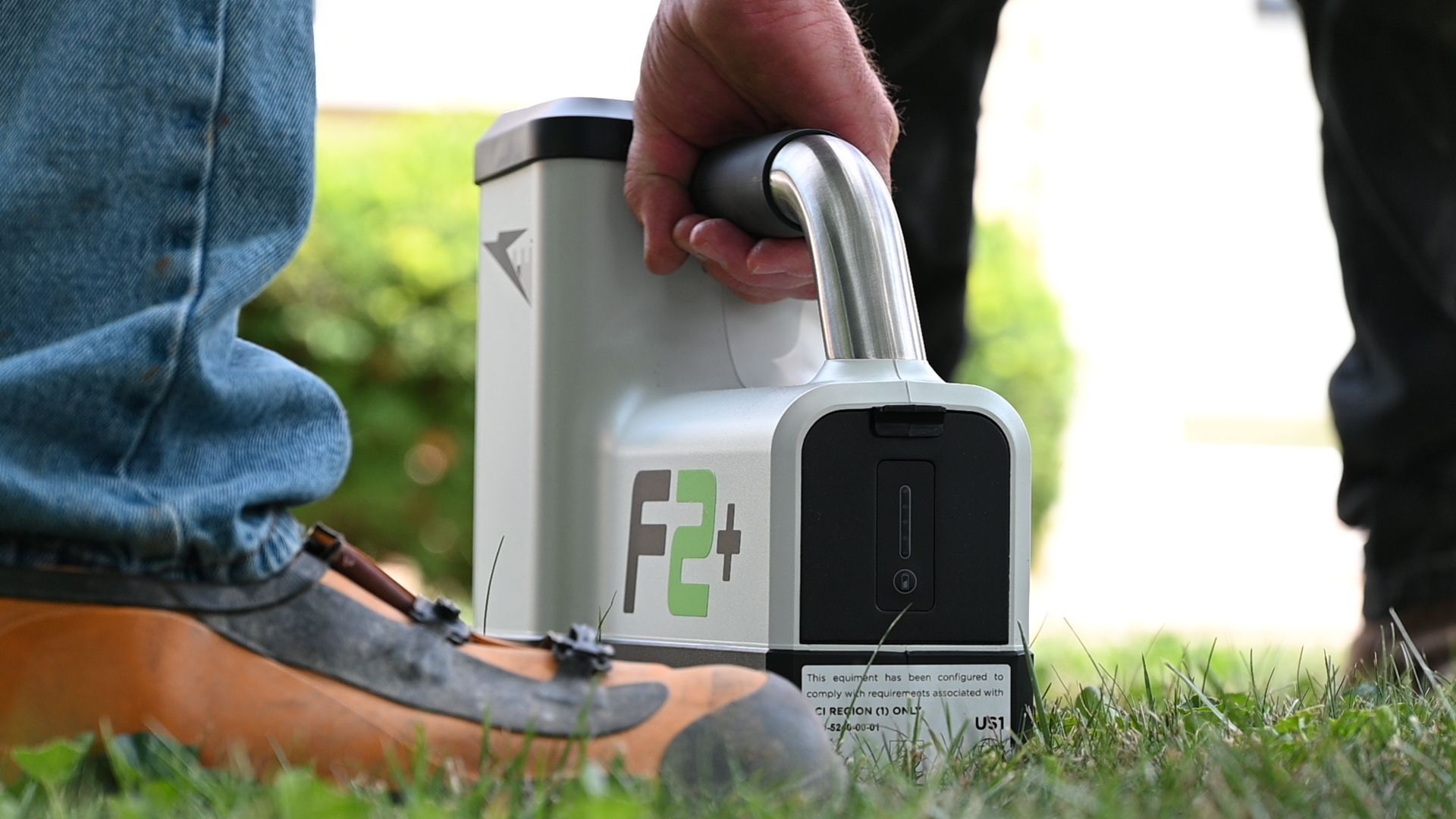 the fair plumber operating a locator for directional boring machine