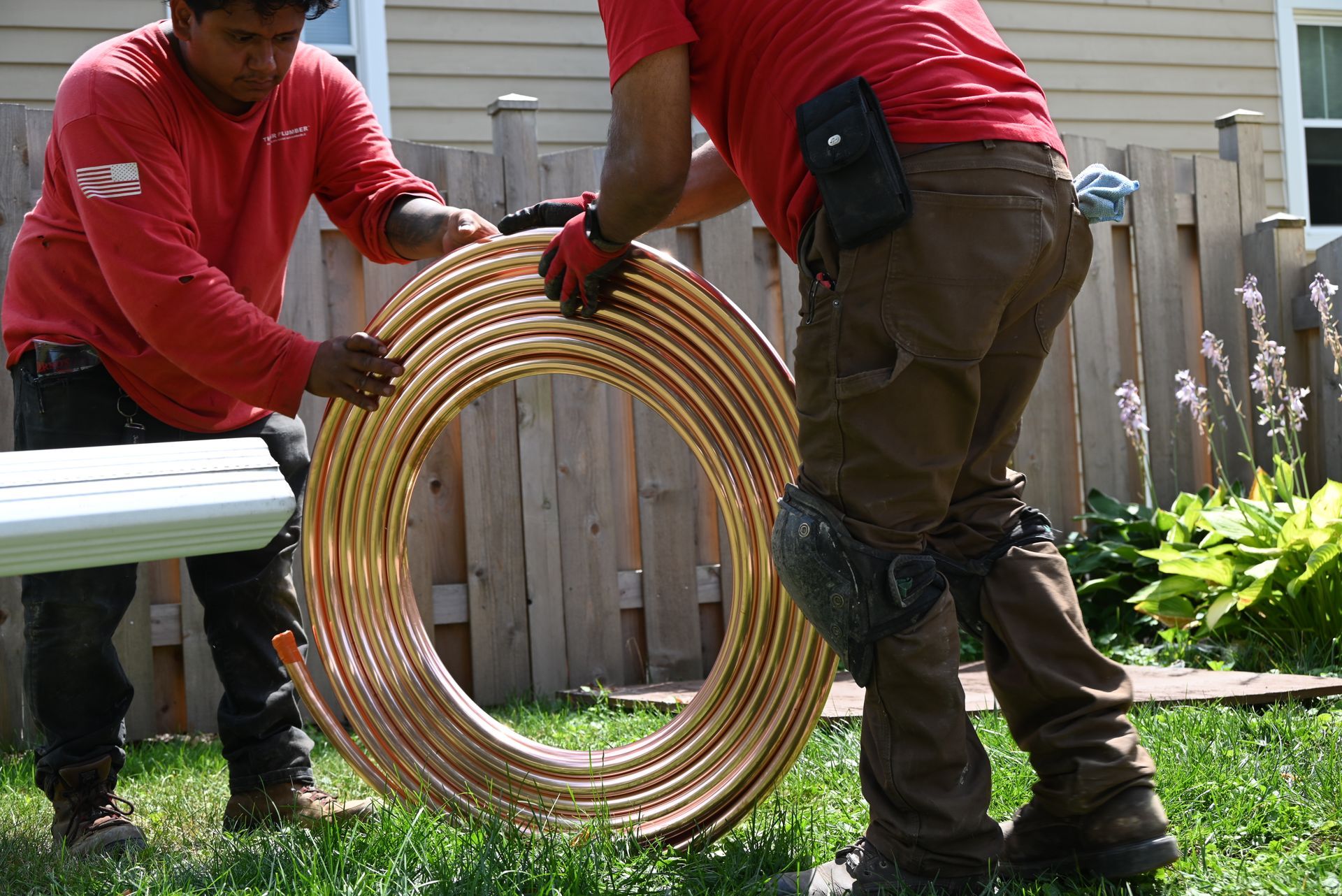 the fair plumber installing a new copper line