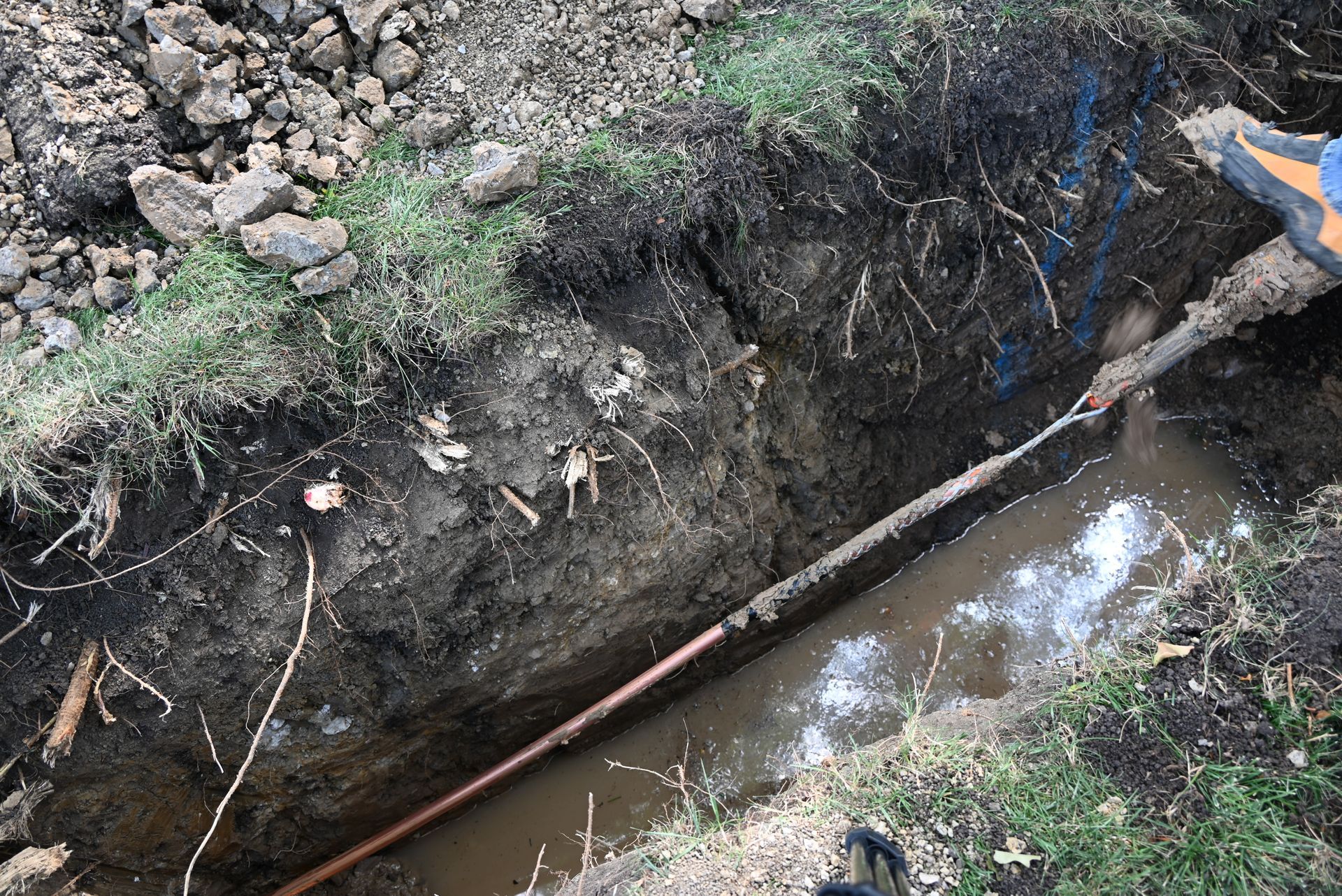 the fair plumber pulling new copper water service