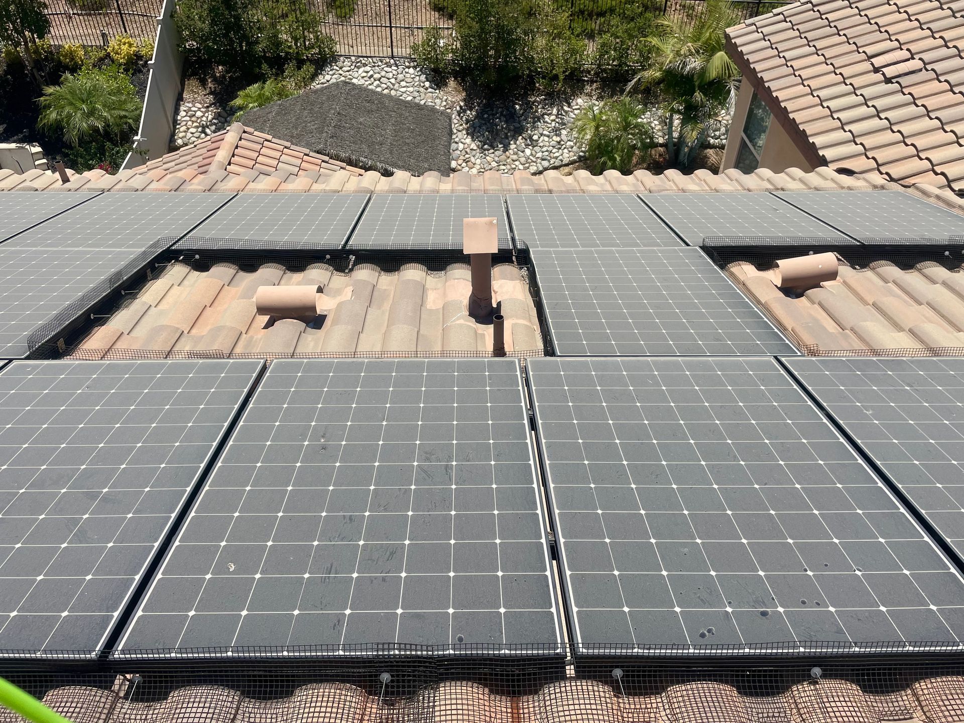 A roof with a lot of solar panels on it