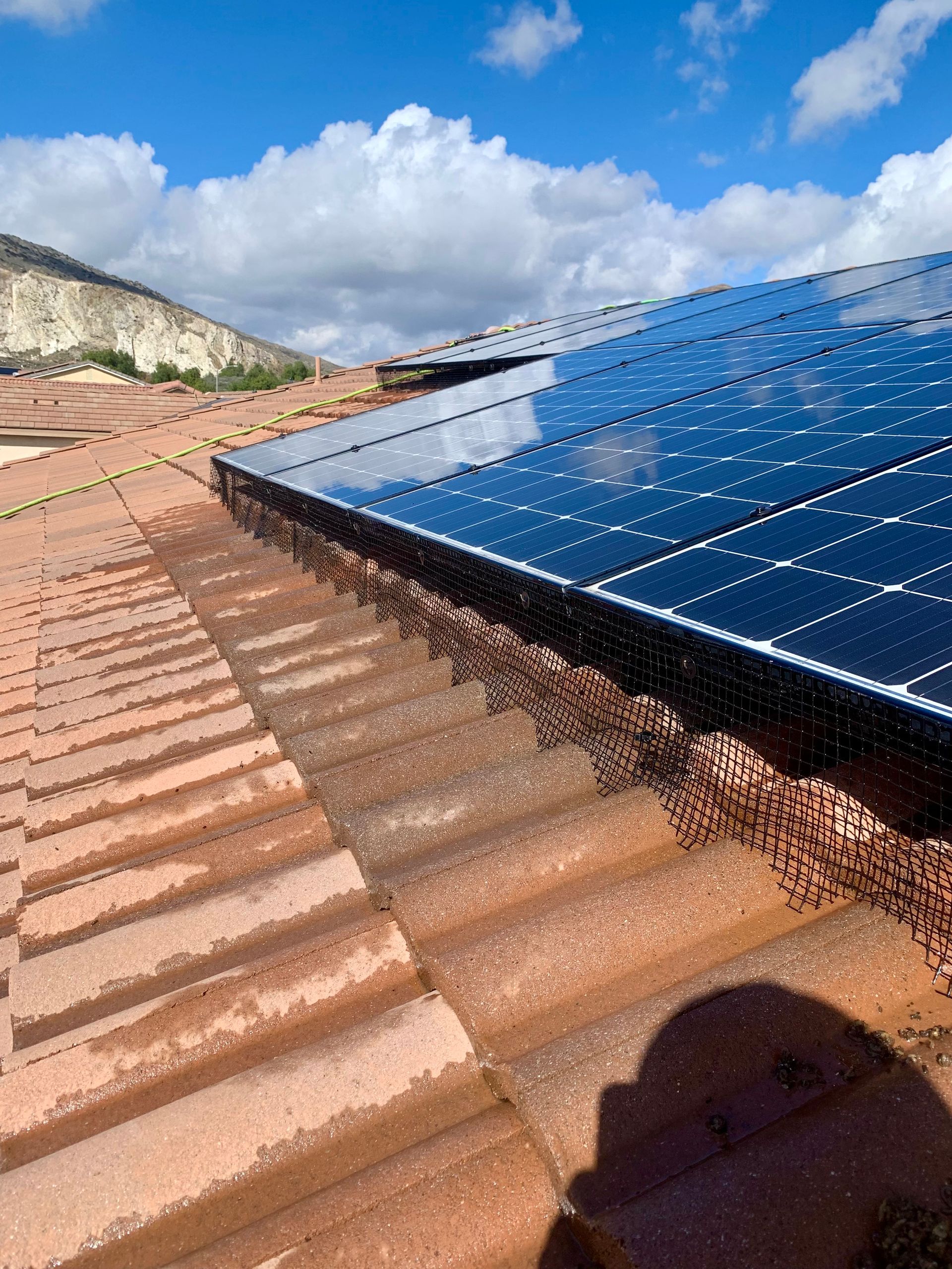 A roof with a lot of solar panels on it
