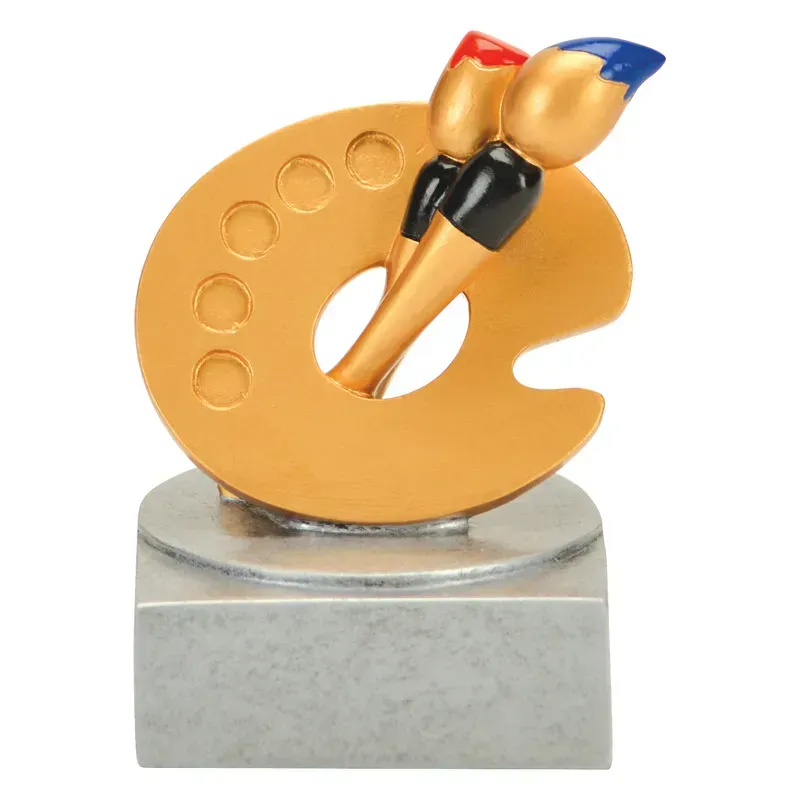 A trophy featuring a gold-colored artist's palette with two brushes, one with a red tip and one with a blue tip, on a base.