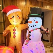 Inflatable gingerbread man and snowman Christmas decorations.